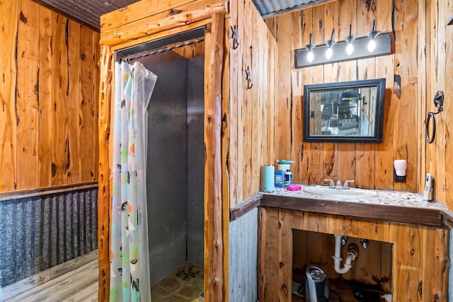 bathroom featuring vanity, curtained shower, wood ceiling, and wooden walls