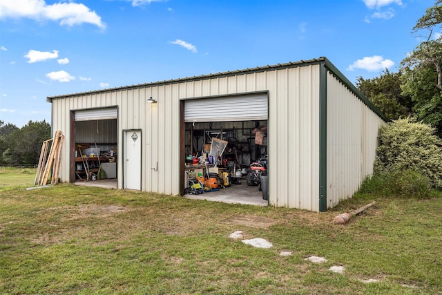 view of outbuilding featuring a yard and a garage