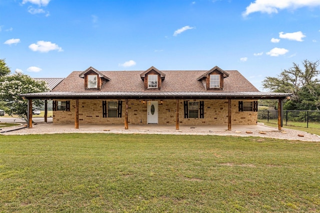 farmhouse inspired home with a front yard and a patio area