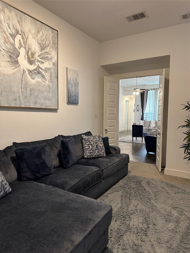 living room with ceiling fan