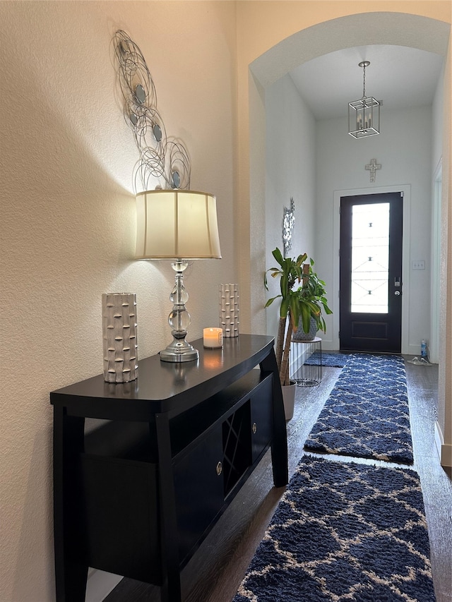 entryway with dark hardwood / wood-style floors