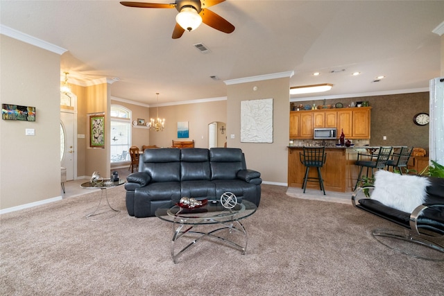 carpeted living room featuring crown molding and ceiling fan with notable chandelier