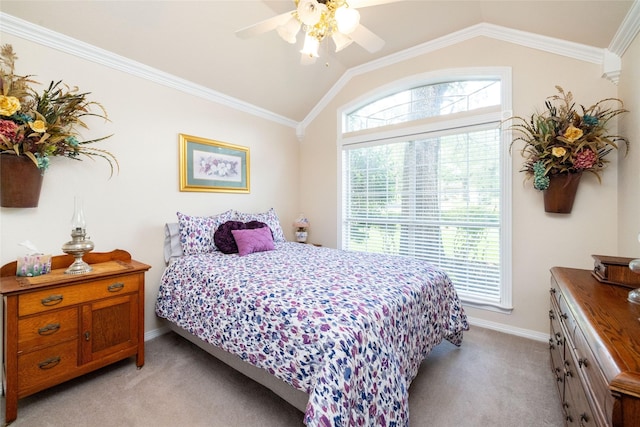 bedroom featuring light colored carpet, vaulted ceiling, ceiling fan, and crown molding