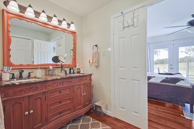 bathroom featuring ceiling fan, french doors, vanity, and hardwood / wood-style flooring