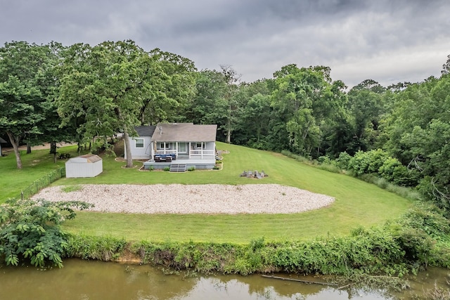 birds eye view of property featuring a water view