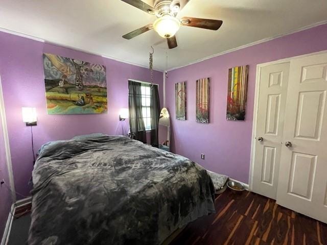 bedroom with ceiling fan, dark hardwood / wood-style flooring, and crown molding