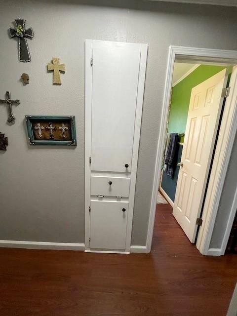 hallway with dark hardwood / wood-style floors