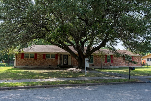 ranch-style house with a front yard