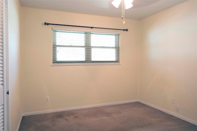 carpeted empty room with baseboards and ceiling fan