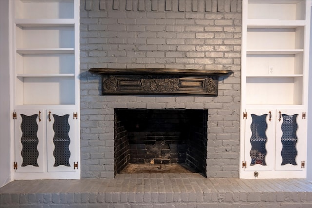 room details with built in features and a fireplace