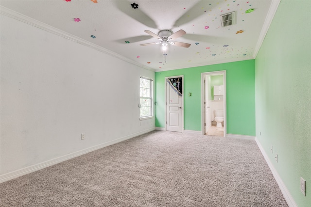 carpeted empty room with ceiling fan and ornamental molding