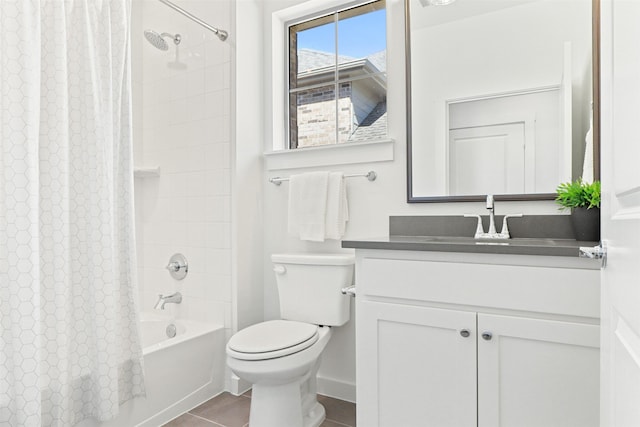 full bathroom with tile patterned flooring, shower / tub combo, vanity, and toilet