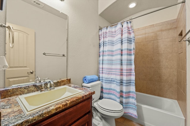 full bathroom featuring tile patterned flooring, vanity, toilet, and shower / bath combo with shower curtain