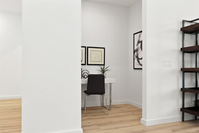 office with light hardwood / wood-style floors