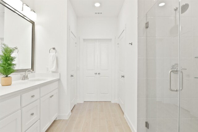 walk in closet featuring light colored carpet