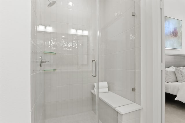 bathroom with a shower with shower door