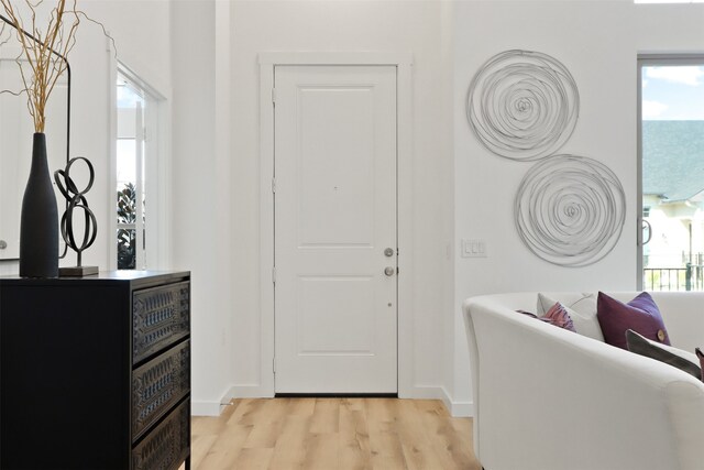 spare room featuring light hardwood / wood-style floors and ceiling fan