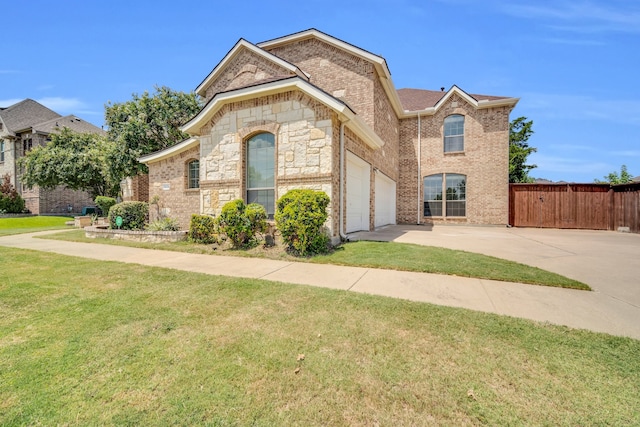 view of front of home featuring a garage and a front yard