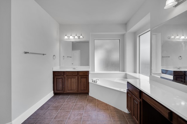 bathroom with vanity, tile patterned floors, and a bathing tub