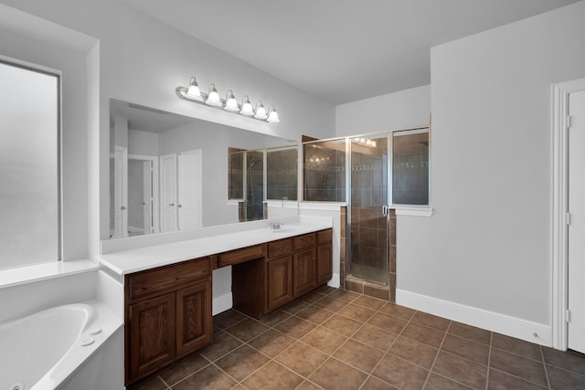 bathroom with tile patterned floors, vanity, and plus walk in shower