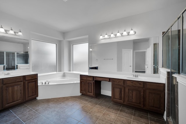 bathroom with vanity, tile patterned flooring, and plus walk in shower