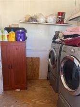 laundry area with washing machine and clothes dryer