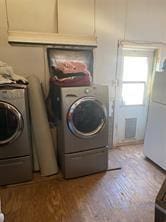 clothes washing area with washer / clothes dryer