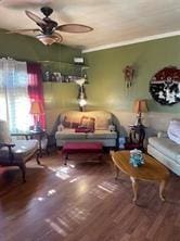 living room with ceiling fan, hardwood / wood-style floors, and ornamental molding