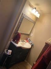 bathroom with tile patterned floors and vanity