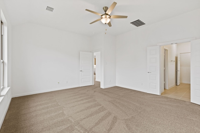 carpeted spare room with ceiling fan