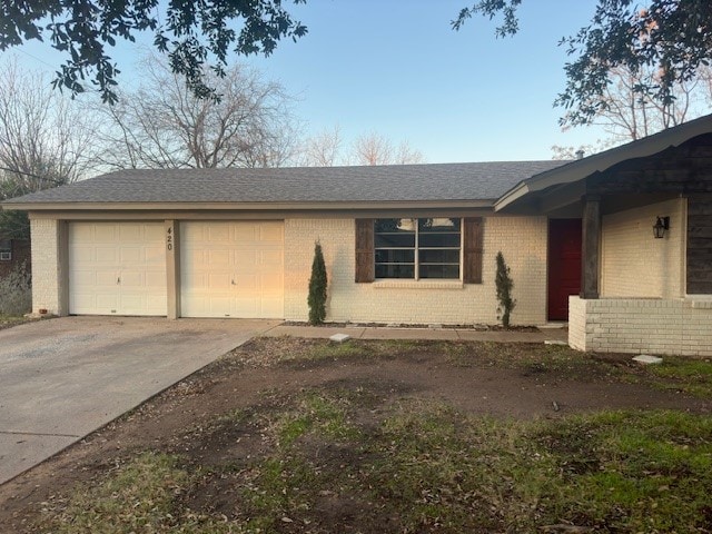 single story home with a garage