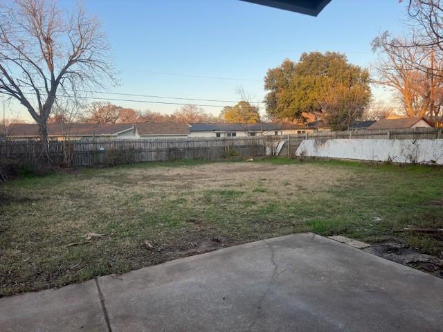 view of yard featuring a patio area and a fenced backyard