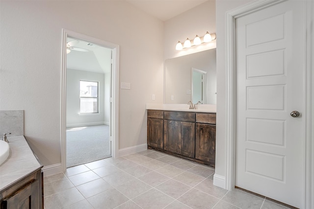 bathroom featuring ceiling fan, vanity, and tile patterned floors