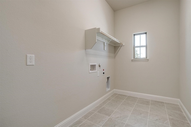 laundry room featuring gas dryer hookup, light tile patterned flooring, hookup for an electric dryer, and washer hookup