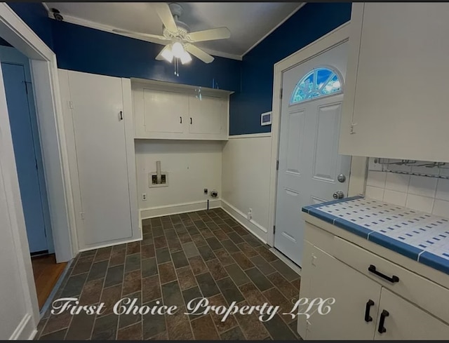 clothes washing area with cabinets, hookup for a washing machine, and ceiling fan