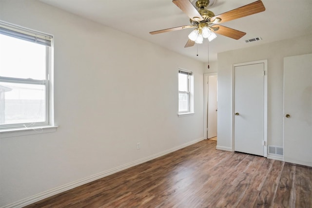 unfurnished bedroom with ceiling fan and hardwood / wood-style flooring