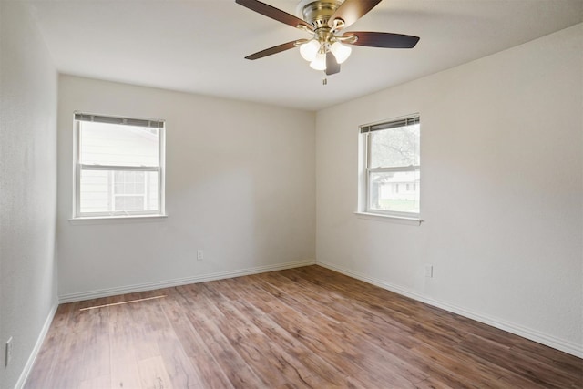 unfurnished room featuring hardwood / wood-style flooring and ceiling fan