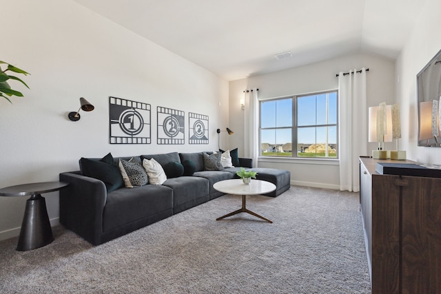 carpeted living room featuring lofted ceiling