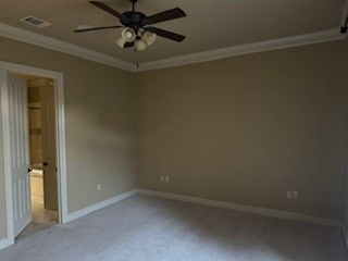 empty room with ceiling fan and crown molding