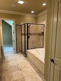 bathroom featuring separate shower and tub and crown molding