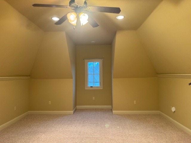 bonus room featuring light colored carpet, ceiling fan, and lofted ceiling