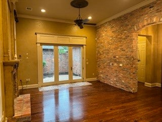 interior space featuring french doors, dark wood-type flooring, ceiling fan, and crown molding