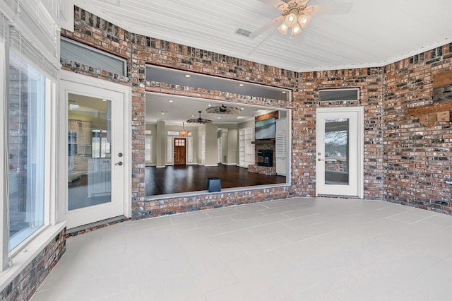 view of patio featuring ceiling fan