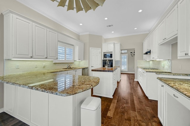 kitchen featuring white cabinetry, dark stone countertops, kitchen peninsula, and black appliances