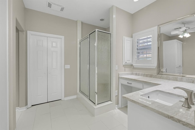 bathroom with vanity, tile patterned flooring, a shower with door, and ceiling fan