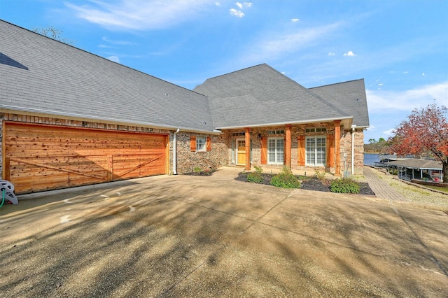 view of front of property featuring a garage and a porch