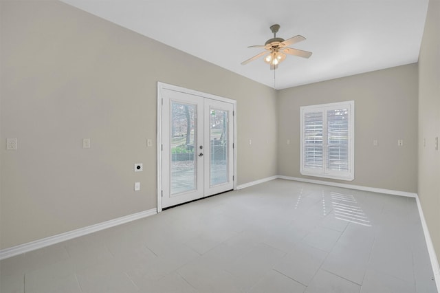 tiled empty room with plenty of natural light, french doors, and ceiling fan