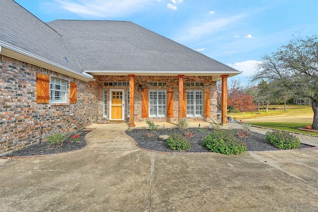 doorway to property with a porch