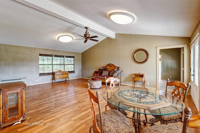 dining room with lofted ceiling with beams, ceiling fan, and light hardwood / wood-style flooring