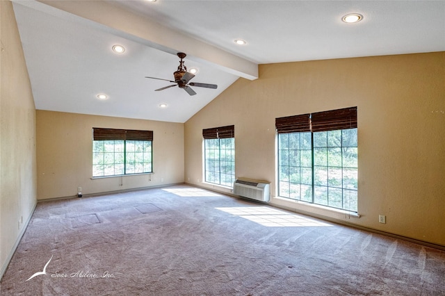 carpeted empty room with vaulted ceiling with beams, a wall unit AC, and ceiling fan